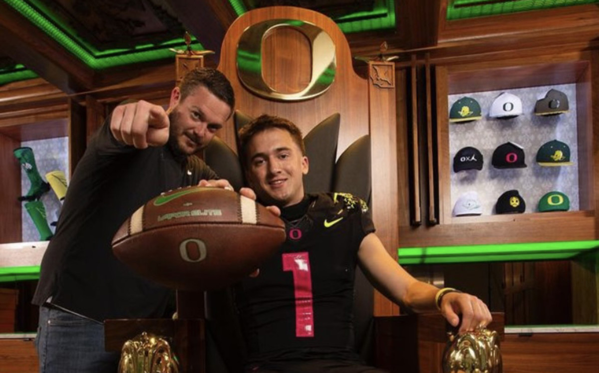Luke Moga poses with Dan Lanning.